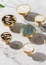 Load image into Gallery viewer, INSPIRA LIFESTYLES - Tos Knob Handles, brass cabinet knobs with decorative inlays, modern round drawer knobs for furniture, closets, wardrobes, and wall hook applications in contemporary interiors