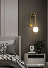Load image into Gallery viewer, INSPIRA LIFESTYLES - Gentry Wall Sconce, postmodern dual globe wall light, frosted glass wall sconce, contemporary bedside wall lighting, sculptural architectural wall lamp, luxury modern wall light in brass finish