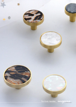 Load image into Gallery viewer, INSPIRA LIFESTYLES - Tos Knob Handles, brass cabinet knobs with decorative inlays, modern round drawer knobs for furniture, closets, wardrobes, and wall hook applications in contemporary interiors