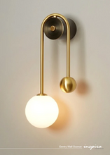 Load image into Gallery viewer, INSPIRA LIFESTYLES - Gentry Wall Sconce, postmodern dual globe wall light, frosted glass wall sconce, contemporary bedside wall lighting, sculptural architectural wall lamp, luxury modern wall light in brass finish