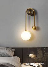 Load image into Gallery viewer, INSPIRA LIFESTYLES - Gentry Wall Sconce, postmodern dual globe wall light, frosted glass wall sconce, contemporary bedside wall lighting, sculptural architectural wall lamp, luxury modern wall light in brass finish