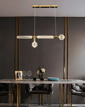 Load image into Gallery viewer, INSPIRA LIFESTYLES | Asterisk Light Sculptural glass pendant light with striped pattern from the Asterisk Light Series, cluster of tubular glass pendants forming a chandelier over stairwell, single striped glass pendant light styled beside bed, modern glass table lamp with striped detailing from the Asterisk Series, floor lamp with sculptural glass shade and minimalist base, high ceiling lighting installation featuring Asterisk pendant cluster, close-up of striped glass tubing on contemporary pendant light.