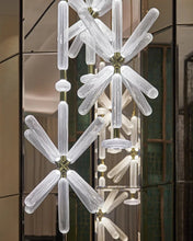 Load image into Gallery viewer, INSPIRA LIFESTYLES | Asterisk Light Sculptural glass pendant light with striped pattern from the Asterisk Light Series, cluster of tubular glass pendants forming a chandelier over stairwell, single striped glass pendant light styled beside bed, modern glass table lamp with striped detailing from the Asterisk Series, floor lamp with sculptural glass shade and minimalist base, high ceiling lighting installation featuring Asterisk pendant cluster, close-up of striped glass tubing on contemporary pendant light.