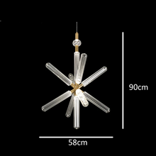 Load image into Gallery viewer, INSPIRA LIFESTYLES | Asterisk Light Sculptural glass pendant light with striped pattern from the Asterisk Light Series, cluster of tubular glass pendants forming a chandelier over stairwell, single striped glass pendant light styled beside bed, modern glass table lamp with striped detailing from the Asterisk Series, floor lamp with sculptural glass shade and minimalist base, high ceiling lighting installation featuring Asterisk pendant cluster, close-up of striped glass tubing on contemporary pendant light.