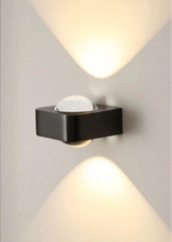 Load image into Gallery viewer, Inspira Lifestyles | Chiaro Wall Sconce with clear glass globe and minimalist Italian design, black/gold/white finish, featuring soft ambient up-and-down LED lighting, ideal for modern living rooms, bedrooms, hallways, and commercial interiors.