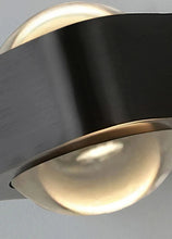 Load image into Gallery viewer, Inspira Lifestyles | Chiaro Wall Sconce with clear glass globe and minimalist Italian design, black/gold/white finish, featuring soft ambient up-and-down LED lighting, ideal for modern living rooms, bedrooms, hallways, and commercial interiors.