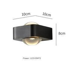 Load image into Gallery viewer, Inspira Lifestyles | Chiaro Wall Sconce with clear glass globe and minimalist Italian design, black/gold/white finish, featuring soft ambient up-and-down LED lighting, ideal for modern living rooms, bedrooms, hallways, and commercial interiors.