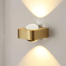 Load image into Gallery viewer, Inspira Lifestyles | Chiaro Wall Sconce with clear glass globe and minimalist Italian design, black/gold/white finish, featuring soft ambient up-and-down LED lighting, ideal for modern living rooms, bedrooms, hallways, and commercial interiors.