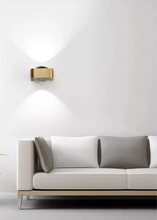 Load image into Gallery viewer, Inspira Lifestyles | Chiaro Wall Sconce with clear glass globe and minimalist Italian design, black/gold/white finish, featuring soft ambient up-and-down LED lighting, ideal for modern living rooms, bedrooms, hallways, and commercial interiors.