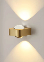 Load image into Gallery viewer, Inspira Lifestyles | Chiaro Wall Sconce with clear glass globe and minimalist Italian design, black/gold/white finish, featuring soft ambient up-and-down LED lighting, ideal for modern living rooms, bedrooms, hallways, and commercial interiors.