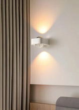 Load image into Gallery viewer, Inspira Lifestyles | Chiaro Wall Sconce with clear glass globe and minimalist Italian design, black/gold/white finish, featuring soft ambient up-and-down LED lighting, ideal for modern living rooms, bedrooms, hallways, and commercial interiors.