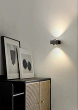 Load image into Gallery viewer, Inspira Lifestyles | Chiaro Wall Sconce with clear glass globe and minimalist Italian design, black/gold/white finish, featuring soft ambient up-and-down LED lighting, ideal for modern living rooms, bedrooms, hallways, and commercial interiors.
