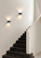 Load image into Gallery viewer, Inspira Lifestyles | Chiaro Wall Sconce with clear glass globe and minimalist Italian design, black/gold/white finish, featuring soft ambient up-and-down LED lighting, ideal for modern living rooms, bedrooms, hallways, and commercial interiors.