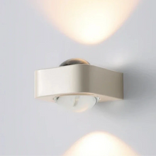 Load image into Gallery viewer, Inspira Lifestyles | Chiaro Wall Sconce with clear glass globe and minimalist Italian design, black/gold/white finish, featuring soft ambient up-and-down LED lighting, ideal for modern living rooms, bedrooms, hallways, and commercial interiors.