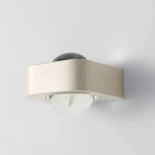 Load image into Gallery viewer, Inspira Lifestyles | Chiaro Wall Sconce with clear glass globe and minimalist Italian design, black/gold/white finish, featuring soft ambient up-and-down LED lighting, ideal for modern living rooms, bedrooms, hallways, and commercial interiors.