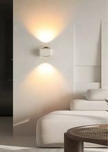 Load image into Gallery viewer, Inspira Lifestyles | Chiaro Wall Sconce with clear glass globe and minimalist Italian design, black/gold/white finish, featuring soft ambient up-and-down LED lighting, ideal for modern living rooms, bedrooms, hallways, and commercial interiors.