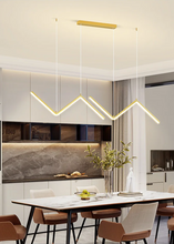 Load image into Gallery viewer, INSPIRA LIFESTYLES - Directions Minimalist Chandelier, LED chandelier, linear pendant light, modern ceiling light, black chandelier, gold chandelier, minimalist lighting, dining room light, kitchen island pendant, contemporary LED fixture, architectural chandelier