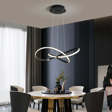 Load image into Gallery viewer, INSPIRA LIFESTYLES | Helia Twisted Pendant Light in chrome, polished gold, and matte black finishes, featuring a sculptural ribbon-like design, suspended with near-invisible wires to create a floating effect, perfect for modern interiors, dining rooms, stairwells, and contemporary living spaces, stylish lighting fixture, luxury pendant light, ambient illumination, contemporary ceiling lighting. Modern Chandelier, Minimalist Chandelier, Sculptural light, Dining table light, Living room light, LED Pendant