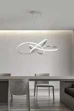 Load image into Gallery viewer, INSPIRA LIFESTYLES | Helia Twisted Pendant Light in chrome, polished gold, and matte black finishes, featuring a sculptural ribbon-like design, suspended with near-invisible wires to create a floating effect, perfect for modern interiors, dining rooms, stairwells, and contemporary living spaces, stylish lighting fixture, luxury pendant light, ambient illumination, contemporary ceiling lighting. Modern Chandelier, Minimalist Chandelier, Sculptural light, Dining table light, Living room light, LED Pendant