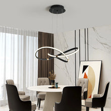 Load image into Gallery viewer, INSPIRA LIFESTYLES | Helia Twisted Pendant Light in chrome, polished gold, and matte black finishes, featuring a sculptural ribbon-like design, suspended with near-invisible wires to create a floating effect, perfect for modern interiors, dining rooms, stairwells, and contemporary living spaces, stylish lighting fixture, luxury pendant light, ambient illumination, contemporary ceiling lighting. Modern Chandelier, Minimalist Chandelier, Sculptural light, Dining table light, Living room light, LED Pendant