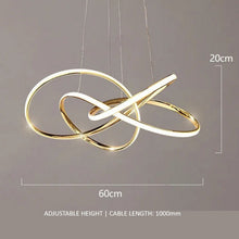 Load image into Gallery viewer, INSPIRA LIFESTYLES | Helia Twisted Pendant Light in chrome, polished gold, and matte black finishes, featuring a sculptural ribbon-like design, suspended with near-invisible wires to create a floating effect, perfect for modern interiors, dining rooms, stairwells, and contemporary living spaces, stylish lighting fixture, luxury pendant light, ambient illumination, contemporary ceiling lighting. Modern Chandelier, Minimalist Chandelier, Sculptural light, Dining table light, Living room light, LED Pendant