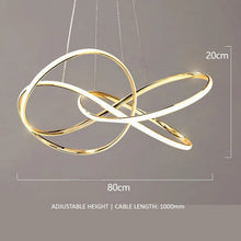 Load image into Gallery viewer, INSPIRA LIFESTYLES | Helia Twisted Pendant Light in chrome, polished gold, and matte black finishes, featuring a sculptural ribbon-like design, suspended with near-invisible wires to create a floating effect, perfect for modern interiors, dining rooms, stairwells, and contemporary living spaces, stylish lighting fixture, luxury pendant light, ambient illumination, contemporary ceiling lighting. Modern Chandelier, Minimalist Chandelier, Sculptural light, Dining table light, Living room light, LED Pendant