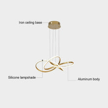 Load image into Gallery viewer, INSPIRA LIFESTYLES | Helia Twisted Pendant Light in chrome, polished gold, and matte black finishes, featuring a sculptural ribbon-like design, suspended with near-invisible wires to create a floating effect, perfect for modern interiors, dining rooms, stairwells, and contemporary living spaces, stylish lighting fixture, luxury pendant light, ambient illumination, contemporary ceiling lighting. Modern Chandelier, Minimalist Chandelier, Sculptural light, Dining table light, Living room light, LED Pendant