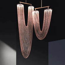 Load image into Gallery viewer, INSPIRA LIFESTYLES - Aurum Draped Pendant, sculptural cascading pendant light, curved metallic chandelier, modern draped ceiling light, architectural statement lighting fixture, metal chain light, metal chainlink chandelier, metal tassel pendant, metal chain wall sconce, metal chain wall lamp