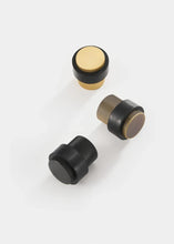 Load image into Gallery viewer, INSPIRA LIFESTYLES - Knurled Floor Door Stops featuring a crisscross diamond knurled pattern and protective rubber bumpers in Matte Black, Satin Brass and Antique Bronze.