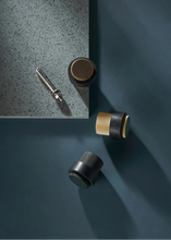 Load image into Gallery viewer, INSPIRA LIFESTYLES - Knurled Floor Door Stops featuring a crisscross diamond knurled pattern and protective rubber bumpers in Matte Black, Satin Brass and Antique Bronze.