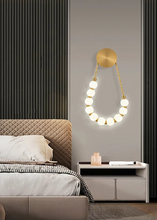 Load image into Gallery viewer, INSPIRA LIFESTYLES - Milli Wall Light, LED wall sconce, frosted globe lighting, sculptural wall lamp, bedroom wall light, living room accent lighting, modern wall sconce, hallway lighting, designer wall fixture, minimalist lighting design, contemporary wall decor, luxury LED light.