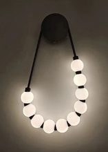 Load image into Gallery viewer, INSPIRA LIFESTYLES - Milli Wall Light, LED wall sconce, frosted globe lighting, sculptural wall lamp, bedroom wall light, living room accent lighting, modern wall sconce, hallway lighting, designer wall fixture, minimalist lighting design, contemporary wall decor, luxury LED light.