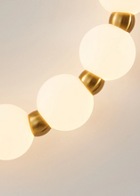 Load image into Gallery viewer, INSPIRA LIFESTYLES - Milli Wall Light, LED wall sconce, frosted globe lighting, sculptural wall lamp, bedroom wall light, living room accent lighting, modern wall sconce, hallway lighting, designer wall fixture, minimalist lighting design, contemporary wall decor, luxury LED light.