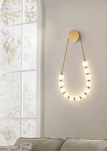 Load image into Gallery viewer, INSPIRA LIFESTYLES - Milli Wall Light, LED wall sconce, frosted globe lighting, sculptural wall lamp, bedroom wall light, living room accent lighting, modern wall sconce, hallway lighting, designer wall fixture, minimalist lighting design, contemporary wall decor, luxury LED light.
