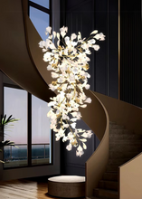 Load image into Gallery viewer, INSPIRA LIFESTYLES - Sculptural Leaf Chandelier, porcelain ginkgo chandelier, cascading porcelain leaf light, gold canopy chandelier, modern statement ceiling light, dining room chandelier, kitchen island pendant light, living room accent lighting, stairwell chandelier, contemporary sculptural light fixture, minimalist gold chandelier, transitional interior lighting, luxury porcelain chandelier, designer lighting fixture
