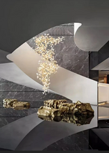 Load image into Gallery viewer, INSPIRA LIFESTYLES - Sculptural Leaf Chandelier, porcelain ginkgo chandelier, cascading porcelain leaf light, gold canopy chandelier, modern statement ceiling light, dining room chandelier, kitchen island pendant light, living room accent lighting, stairwell chandelier, contemporary sculptural light fixture, minimalist gold chandelier, transitional interior lighting, luxury porcelain chandelier, designer lighting fixture