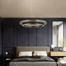 Load image into Gallery viewer, INSPIRA LIFESTYLES – Anello Duo Chandelier – sculptural two-tier chandelier with wood-patterned ring and matte black ring. Modern LED light fixture for dining rooms, living rooms, stairwells, offices, and transitional interiors.