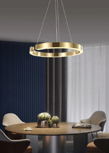 Load image into Gallery viewer, INSPIRA LIFESTYLES – Cuff Circular Pendant, modern ring chandelier in rose gold, gold, black, and white, minimalist circular LED pendant light for dining rooms, conference rooms, double-height spaces, and contemporary interiors