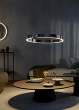 Load image into Gallery viewer, INSPIRA LIFESTYLES – Cuff Circular Pendant, modern ring chandelier in rose gold, gold, black, and white, minimalist circular LED pendant light for dining rooms, conference rooms, double-height spaces, and contemporary interiors