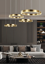 Load image into Gallery viewer, INSPIRA LIFESTYLES – Cuff Circular Pendant, modern ring chandelier in rose gold, gold, black, and white, minimalist circular LED pendant light for dining rooms, conference rooms, double-height spaces, and contemporary interiors