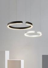 Load image into Gallery viewer, INSPIRA LIFESTYLES – Cuff Circular Pendant, modern ring chandelier in rose gold, gold, black, and white, minimalist circular LED pendant light for dining rooms, conference rooms, double-height spaces, and contemporary interiors