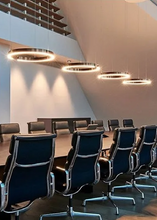 Load image into Gallery viewer, INSPIRA LIFESTYLES – Cuff Circular Pendant, modern ring chandelier in rose gold, gold, black, and white, minimalist circular LED pendant light for dining rooms, conference rooms, double-height spaces, and contemporary interiors