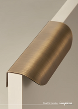 Load image into Gallery viewer, INSPIRA LIFESTYLES - RIVA PULL HANDLES, EDGE PULL HANDLES, SOLID BRASS CABINET HANDLE, MODERN ARC HANDLE, ERGONOMIC CABINET PULL, MINIMAL CABINET HARDWARE, BUILT IN EDGE PULL, KITCHEN DRAWER EDGE HANDLE, ANTIQUE BRONZE CABINET HANDLE, BRUSHED GOLD EDGE PULL, BLACK CABINET HARDWARE, WHITE CABINET HANDLE, ARCHITECTURAL CABINET HARDWARE, CONTEMPORARY MILLWORK HARDWARE, INSPIRA LIFESTYLES