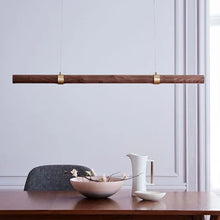Load image into Gallery viewer, INSPIRA LIFESTYLES |  Klaxon Wood Pendant, Walnut Chandelier Walnut Light, WOODEN LIGHT FIXTURE, WOODEN CHANDELIER, WOOD PENDANT LIGHT, WOOD LIGHT, SIMPLE WOOD LINEAR LIGHT, PENDANT LIGHT FIXTURE, MODERN WOOD CHANDELIER, MODERN PENDANT LIGHT, Modern Dining Room Lighting, Minimalist LED Pendant, Linear Pendant Lighting, LINEAR LIGHT, LED PENDANT, KITCHEN ISLAND LIGHT, HANGING WOOD LIGHT, Dining Table Lighting, Dining Room LED Light, DINING LIGHT, Contemporary Pendant Light, Bar Pendant Lights