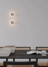 Load image into Gallery viewer, Inspira Lifestyles | Onda Crystal Wall Light with round optical crystal disc and chrome center, mounted as a modern LED wall or ceiling sconce.