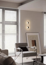 Load image into Gallery viewer, Inspira Lifestyles | Onda Crystal Wall Light with round optical crystal disc and chrome center, mounted as a modern LED wall or ceiling sconce.