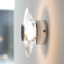 Load image into Gallery viewer, Inspira Lifestyles | Onda Crystal Wall Light with round optical crystal disc and chrome center, mounted as a modern LED wall or ceiling sconce.