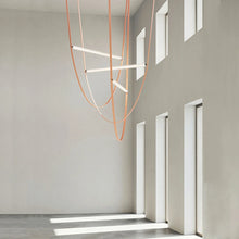 Load image into Gallery viewer, Parabola Belt Pendant | INSPIRA LIFESTYLES - Modern Minimalist Belt Pendant Lamp for high ceilings, Glass Tube Pendant Light, Creative LED Lighting Fixture, Living Room Pendant Light, Duplex Villa Pendant Lamp, Staircase Lighting Pendant, Minimalist Glass Tube Lamp, Contemporary LED Pendant Light, Elegant Belt Pendant Lamp, Stylish Modern Lighting, High-End Glass Pendant Light, Modern Living Room Illumination, Chic Duplex Villa Lamp, leather pendant light, industrial modern lighting