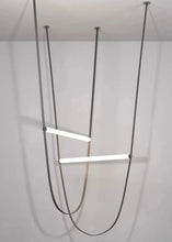 Load image into Gallery viewer, Parabola Belt Pendant | INSPIRA LIFESTYLES - Modern Minimalist Belt Pendant Lamp for high ceilings, Glass Tube Pendant Light, Creative LED Lighting Fixture, Living Room Pendant Light, Duplex Villa Pendant Lamp, Staircase Lighting Pendant, Minimalist Glass Tube Lamp, Contemporary LED Pendant Light, Elegant Belt Pendant Lamp, Stylish Modern Lighting, High-End Glass Pendant Light, Modern Living Room Illumination, Chic Duplex Villa Lamp, leather pendant light, industrial modern lighting