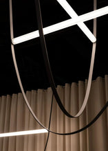 Load image into Gallery viewer, Parabola Belt Pendant | INSPIRA LIFESTYLES - Modern Minimalist Belt Pendant Lamp for high ceilings, Glass Tube Pendant Light, Creative LED Lighting Fixture, Living Room Pendant Light, Duplex Villa Pendant Lamp, Staircase Lighting Pendant, Minimalist Glass Tube Lamp, Contemporary LED Pendant Light, Elegant Belt Pendant Lamp, Stylish Modern Lighting, High-End Glass Pendant Light, Modern Living Room Illumination, Chic Duplex Villa Lamp, leather pendant light, industrial modern lighting